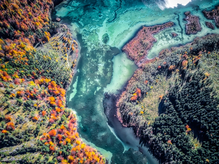 Aerial shot of a mountain river in fall
